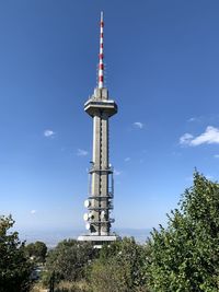 Low angle view of communications tower against sky