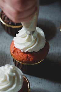 Close-up of cupcake and icing topping