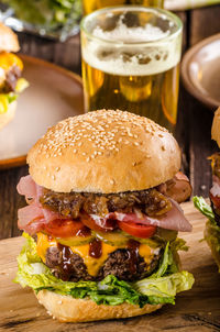 Close-up of burger on serving board at table