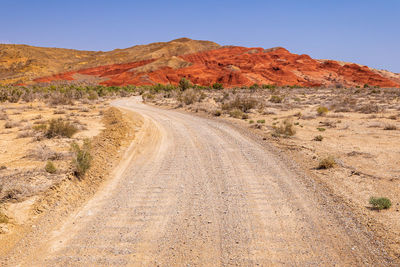 Dirt road passing through a desert