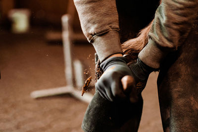 Low section of man holding hands