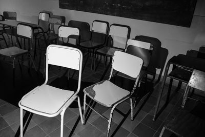 Empty chairs and tables in background