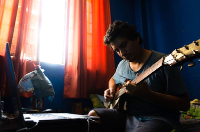 Young man playing guitar