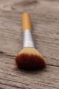 Close-up of make-up brush on table