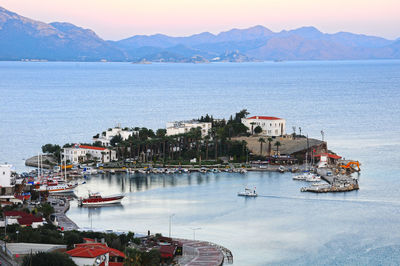 High angle view of boats moored in sea against sky