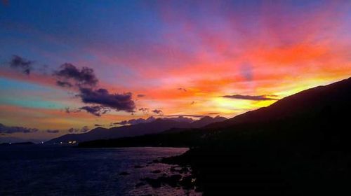 Scenic view of mountains against sky during sunset