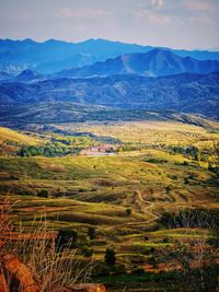 Scenic view of landscape and mountains against sky