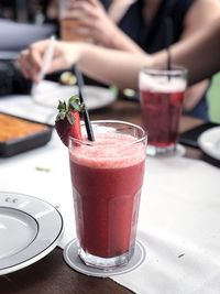 Close-up of strawberry juice on table