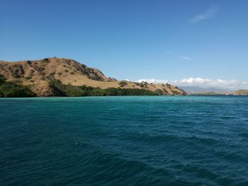 Scenic view of sea against blue sky