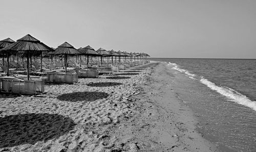 Pier on sea against clear sky