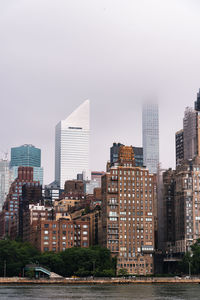 Modern buildings in city against sky