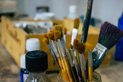 Close-up of paintbrushes on table