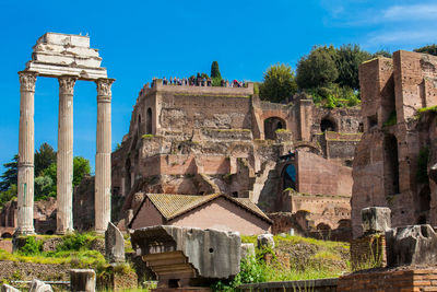 Remains of the temple of castor and pollux and the basilica julia at the roman forum in rome