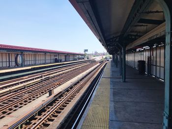 Railroad station against blue sky