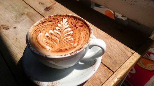 High angle view of cappuccino on table