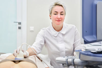 Gynecologist examining patient