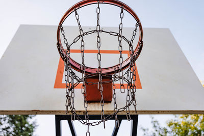 View from the front of a park basketball hoop