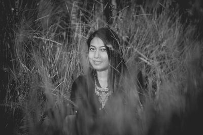 Portrait of smiling young woman on field