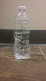 Close-up of glass bottle on table