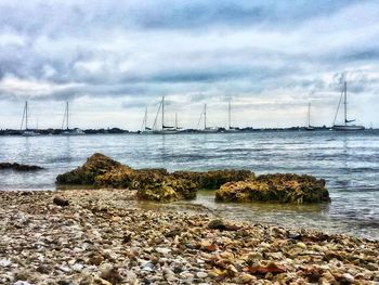 Scenic view of sea against cloudy sky