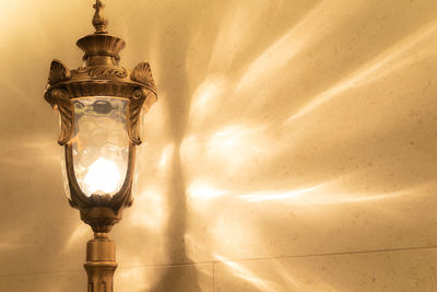 Low angle view of illuminated lights hanging from ceiling