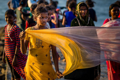 Close-up of young woman at music concert