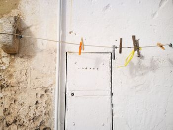 Clothes hanging on white wall