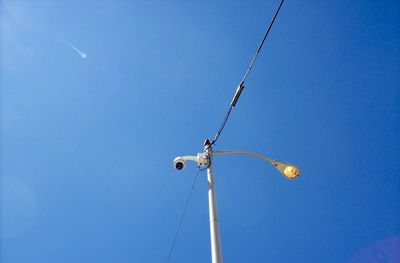 Low angle view of street light against clear blue sky