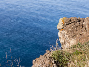 High angle view of rock formation by sea