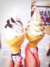 Cropped hand holding ice cream cone