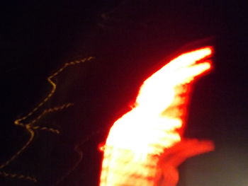 Close-up of bonfire against sky at night