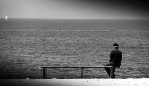Silhouette of woman standing on beach