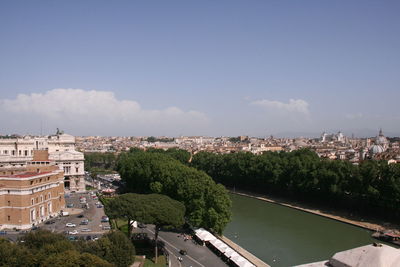 High angle view of buildings and trees against sky