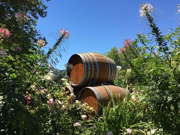 View of wooden barrels against sky