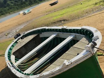 High angle view of tire tracks on field