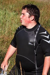 Full length of young man on field