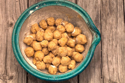 High angle view of dough in bowl on table