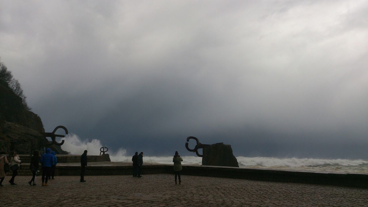 sky, cloud - sky, cloudy, weather, overcast, cloud, built structure, architecture, nature, day, outdoors, tranquility, building exterior, bench, incidental people, beach, dusk, tranquil scene, men