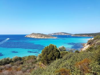 Panoramic view of sea against clear blue sky