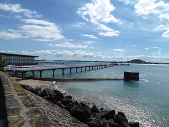 Pier over sea against sky