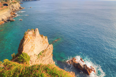 High angle view of rock formation in sea