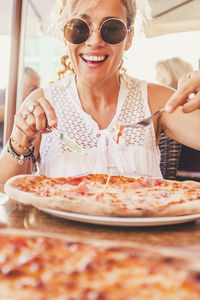 Portrait of woman having food