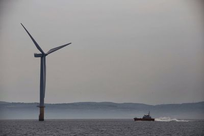 Ship in sea against sky