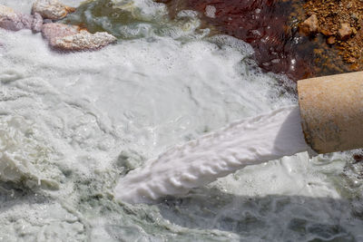 High angle view of water flowing in sea