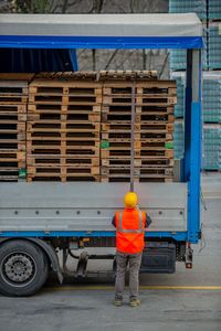 Rear view of man working at construction site