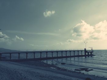 Scenic view of sea against cloudy sky