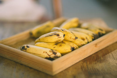 Close-up of yellow fruits on table at market