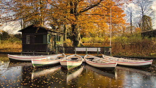 Boats on frozen lake at frederiksberg gardens, copenhagen
