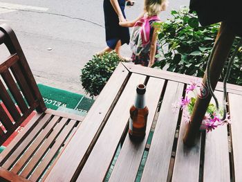 High angle view of woman sitting on bench