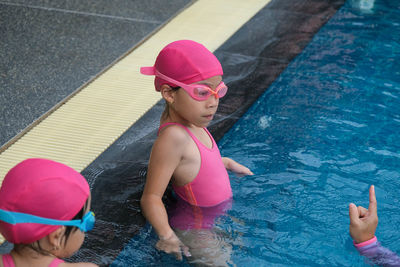 High angle view of boy swimming in pool